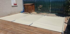 Couverture de sécurité à barres sur piscine coque polyester -10m²